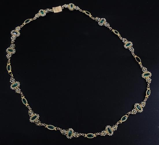 An early 19th century gold, green paste and seed pearl set spectacle necklace, 15.75in.